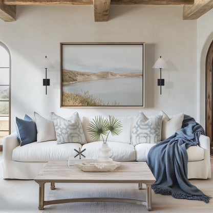 Framed photo of: Drakes Bay 7383 displayed above a couch in a coastal living room.