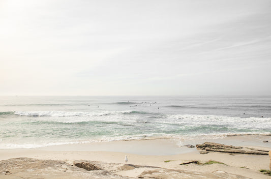 Photography by Kim Dybczak of: Bright Salt Creek shoreline with pale sand and gentle waves under clear coastal light.