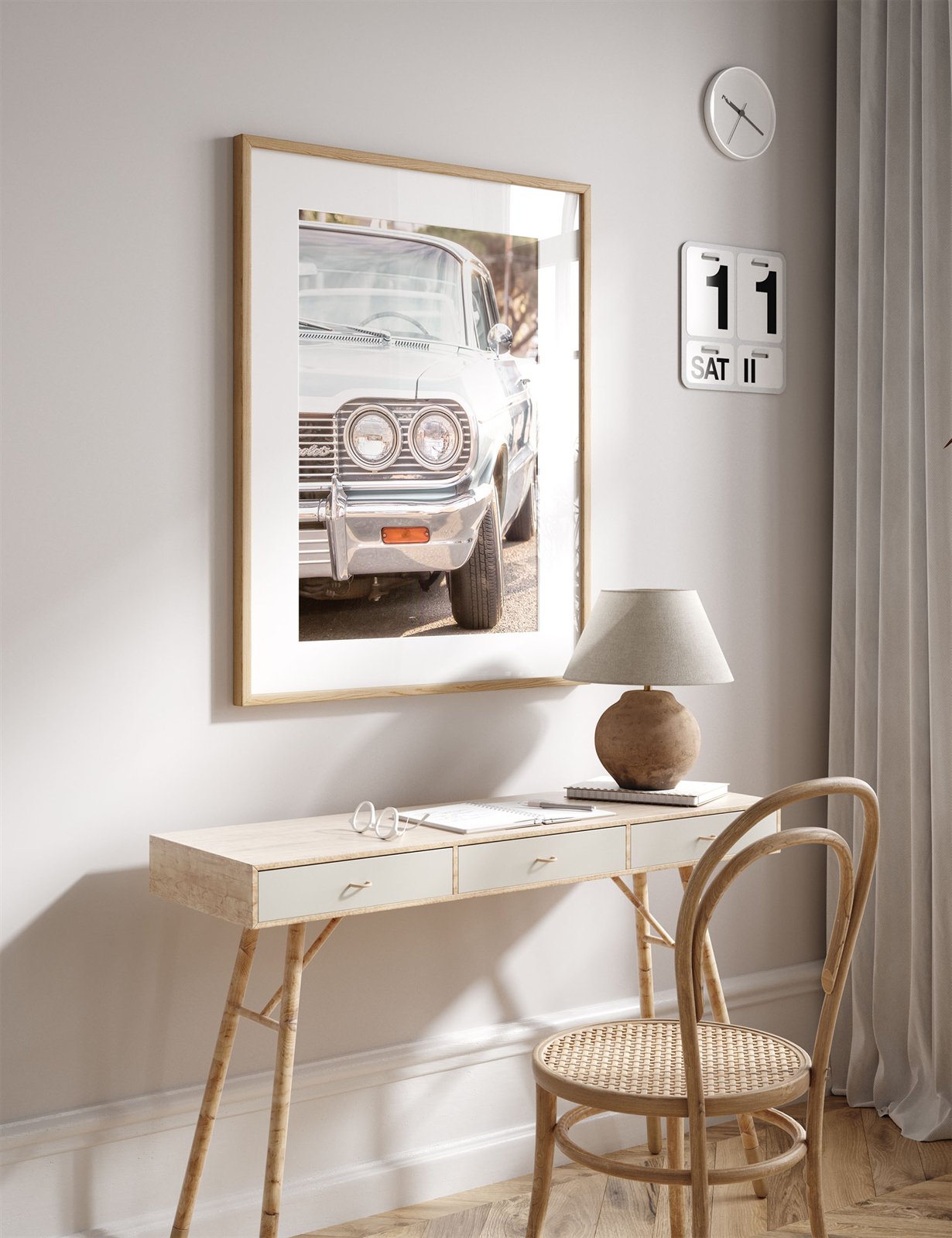 Framed photo of: Chevrolet 7975 displayed on a wall above a desk in a neutral office.
