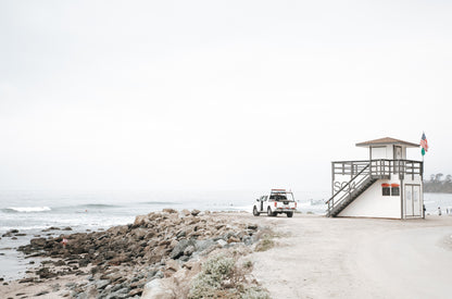 Photography by Kim Dybczak of: Crowds gather on a busy beach in Salt Creek, with people in the surf and across the sand.