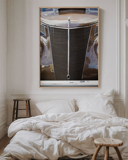 Framed photo of: Ford 7803 displayed above a bed in a cozy bedroom. 