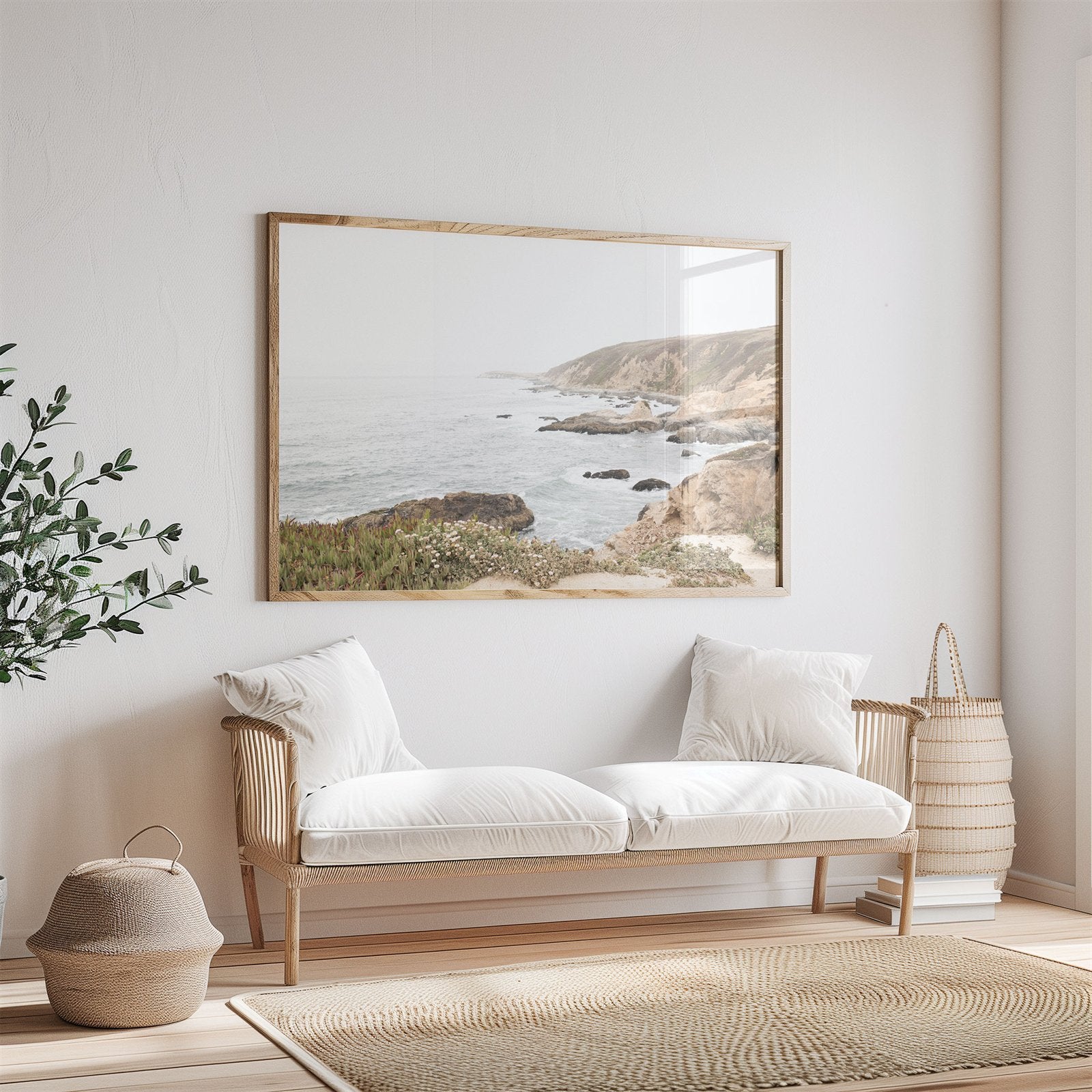 Framed photo of: Bodega Head 7728 displayed above a couch.