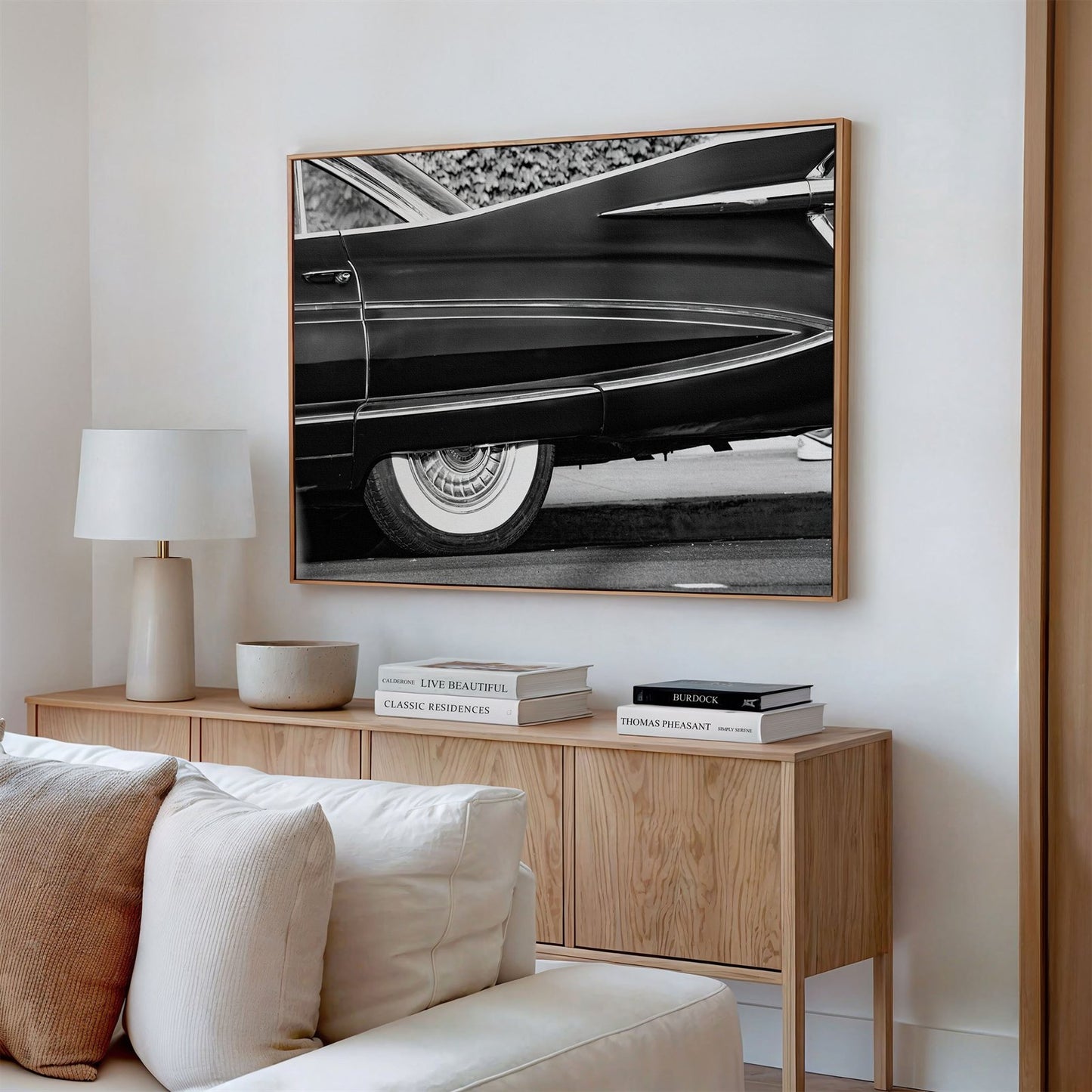 Framed canvas photo of: Cadillac Fleetwood 7961 displayed above a couch in a modern living room. 