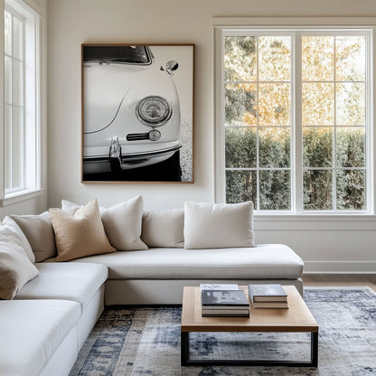 Framed photo of: Porsche 8259 displayed above a couch in a modern coastal living room.