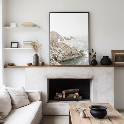 Framed photo of: Bodega Head 7724 displayed above a fireplace in a neutral modern living room.