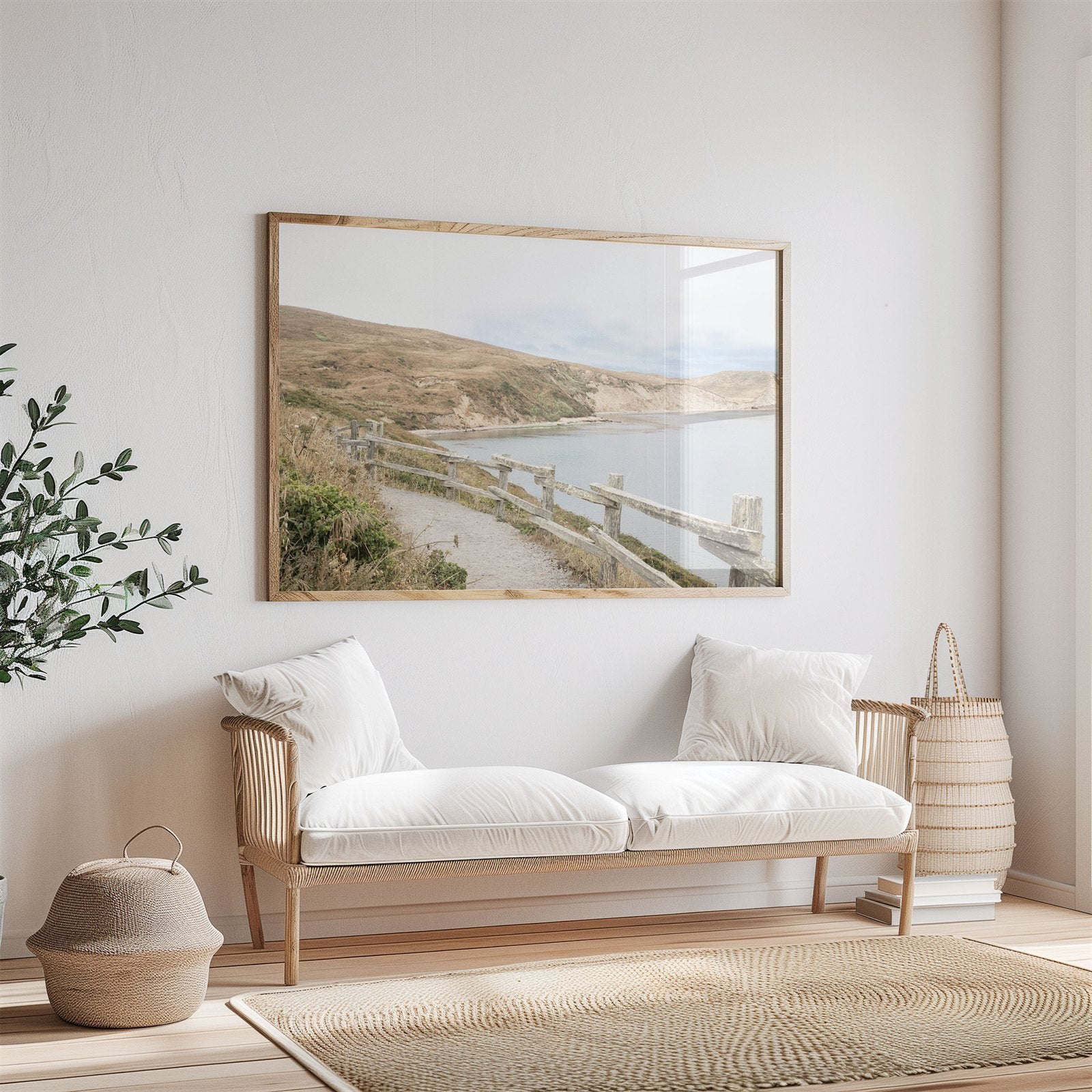 Framed photo of: Drakes Bay 7372 displayed above a couch in a neutral room.