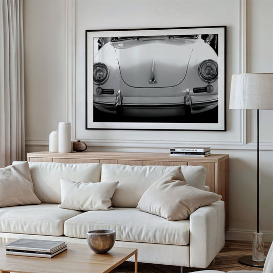 Framed photo of: Porsche 8258 displayed above a couch.
