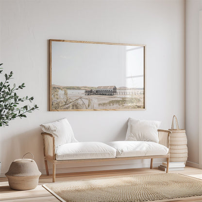 Framed photo of: Tomales Bay 7146 displayed above couch in a neutral living room.