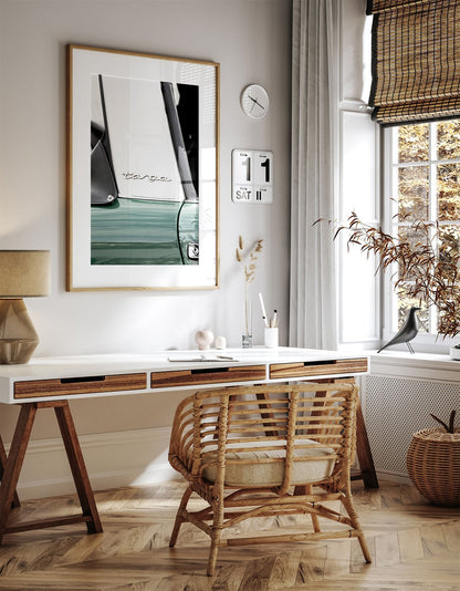 Framed photo of: Targa 8000 displayed on a wall above a desk.