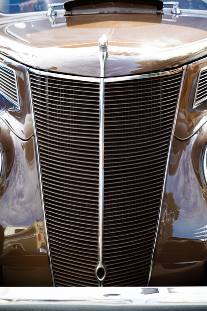 Photography by Salt Creek Prints of: Ford 7803, Close up image of the grill of a vintage Ford Delux. 
