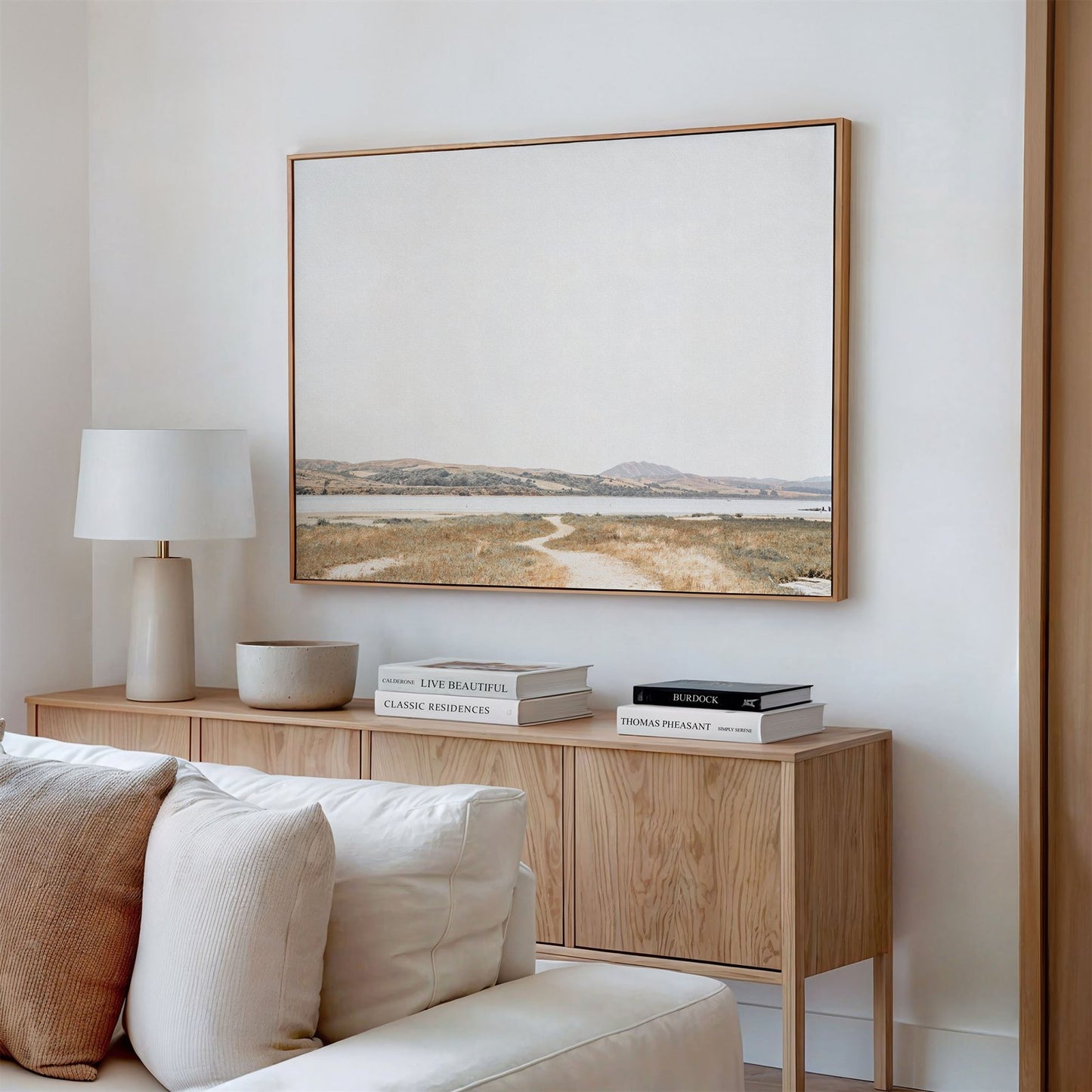 Framed canvas photo of: Tomales Bay 7147 displayed on a wall above a console in a modern living room.