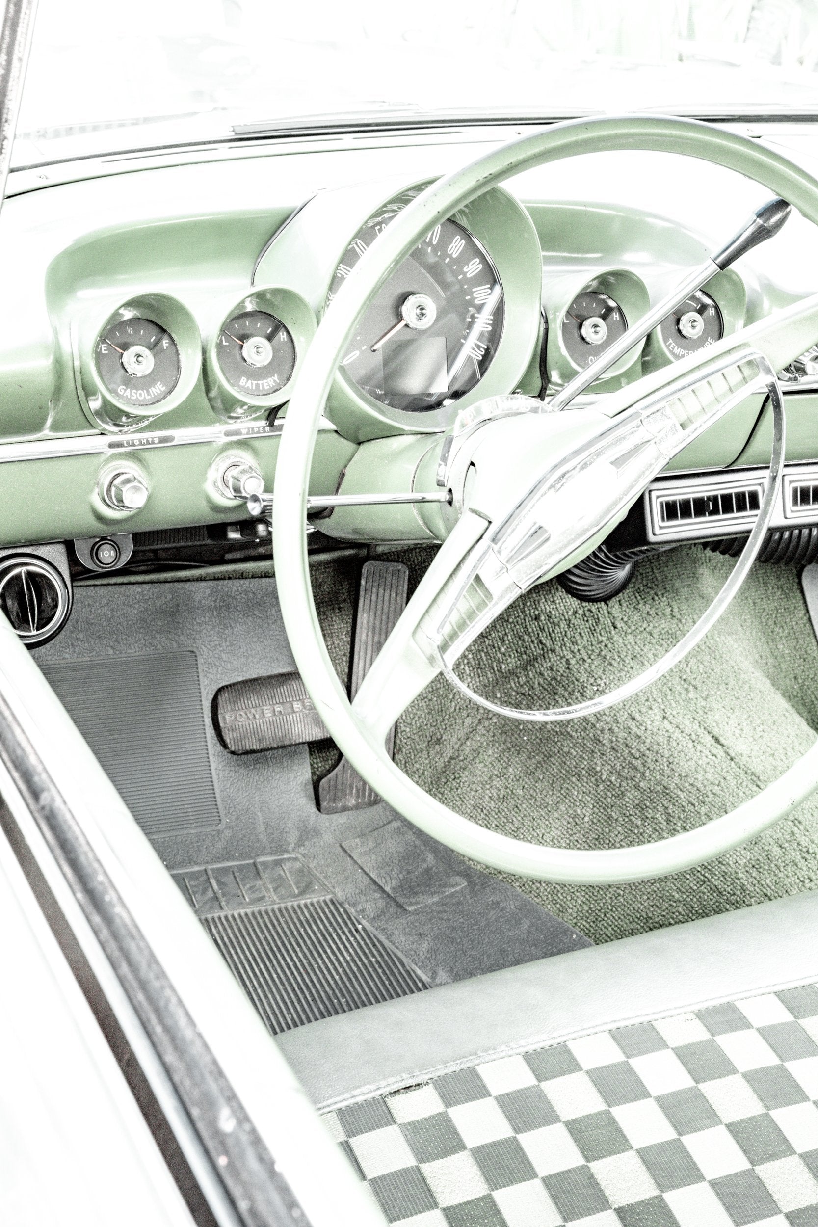Photography by Salt Creek Prints of: Bel Air 7889, Close up image of the steering wheel and dash of a vintage Chevrolet Bel Air in mint green.