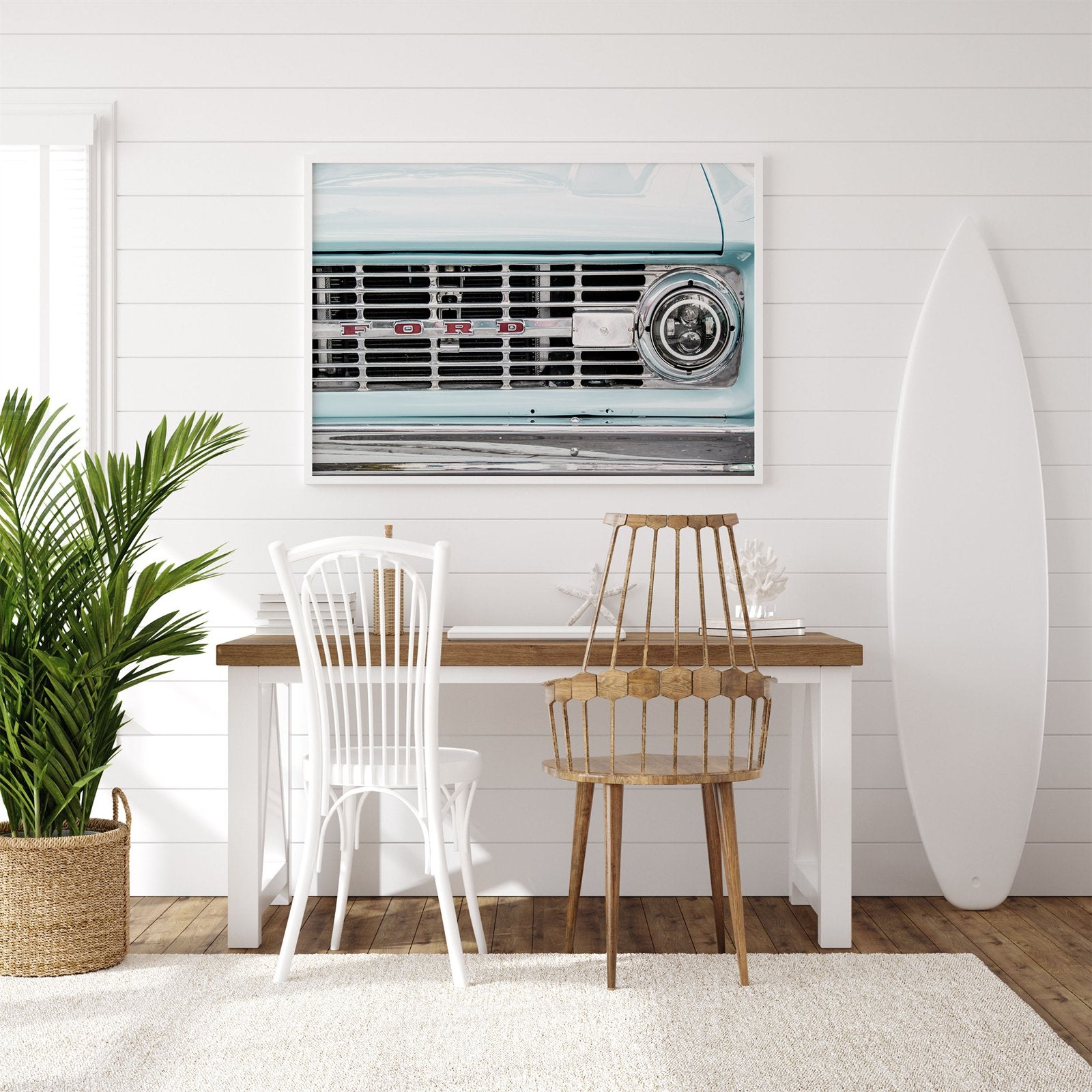 Framed photo of: Vintage Ford 7815 displayed above a desk in a surf theme office.