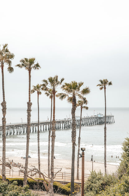 Photography by Kim Dybczak of: The pier at San Clemente Pier reaches over rolling water toward open sea.