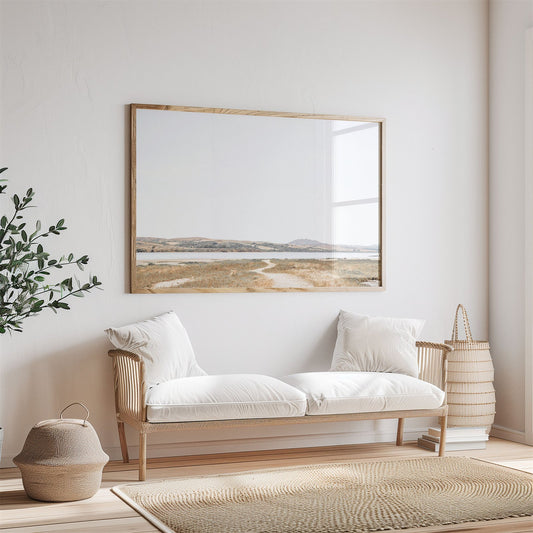 Framed photo of: Tomales Bay 7147 displayed above a couch in a neutral room.