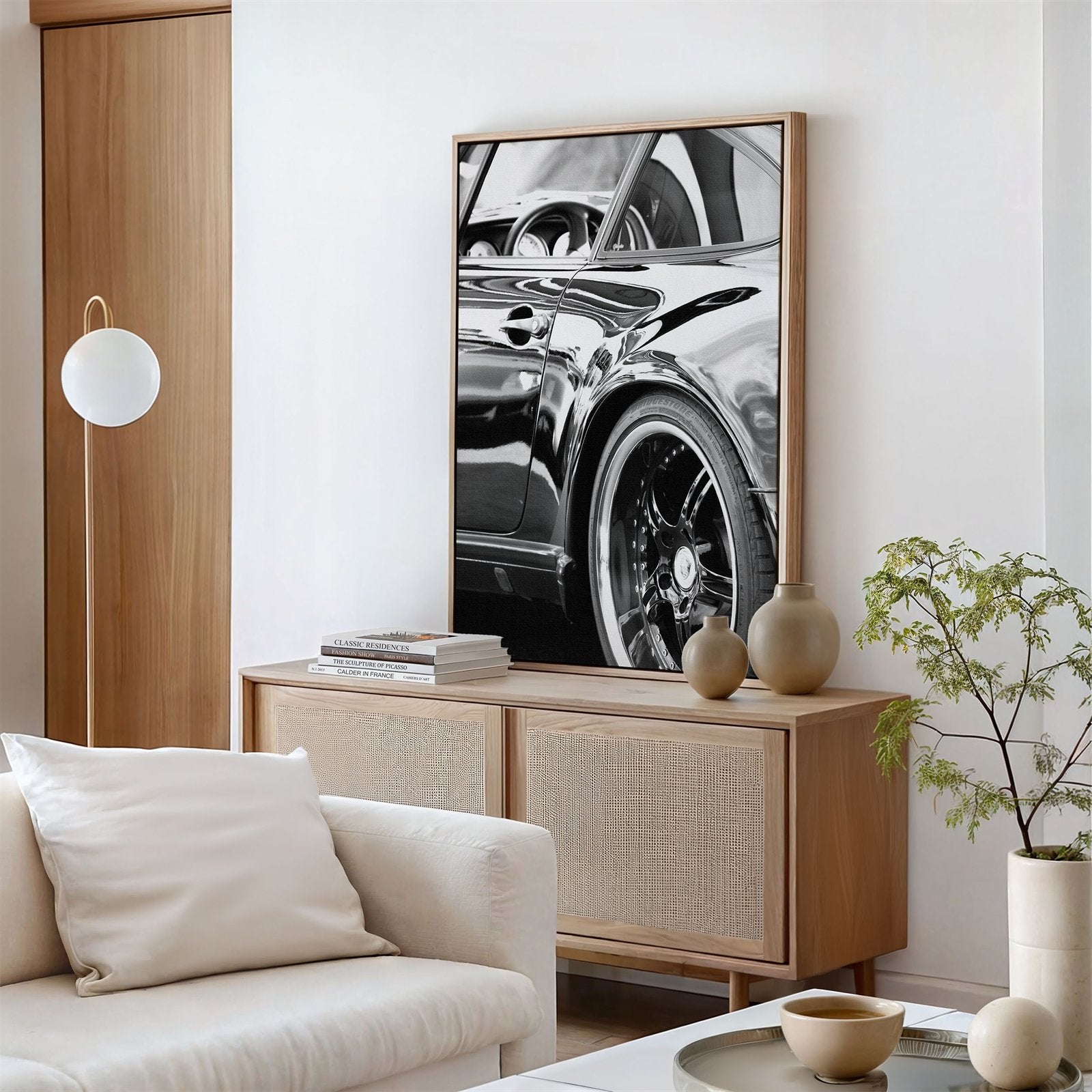 Framed canvas photo of: Porsche 8346 displayed above a console in a living room.