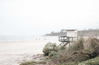 Photography by Kim Dybczak of: People crowd a Salt Creek beach, spreading from the sand into the breaking surf.
