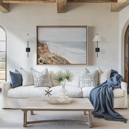 Framed photo of: Carlsbad 2309 displayed above a couch in a coastal living room.