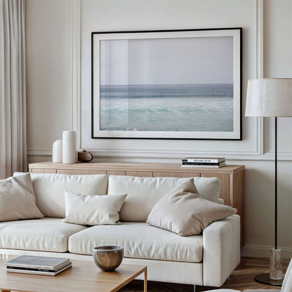 Framed photo of: Torrey Pines 8653 displayed above a couch in a modern living room.