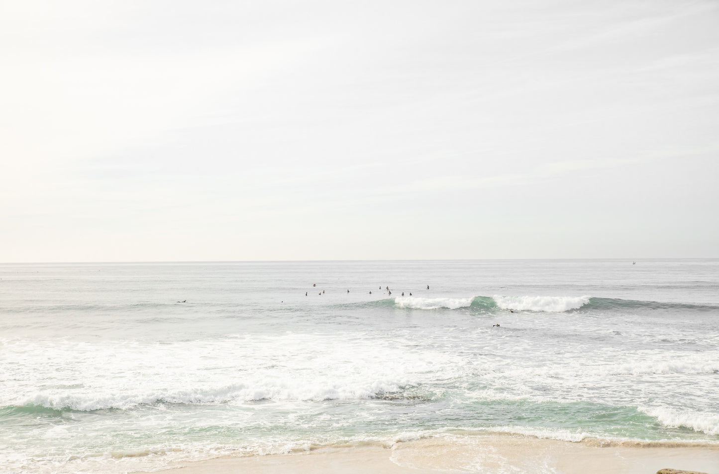 Photography by Kim Dybczak of: Bright Salt Creek shoreline with pale sand and gentle waves under clear coastal light.