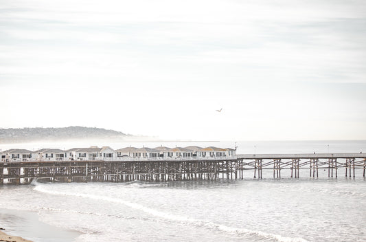 Photography by Kim Dybczak of: Crystal Pier extends into calm water at Pacific Beach in San Diego.
