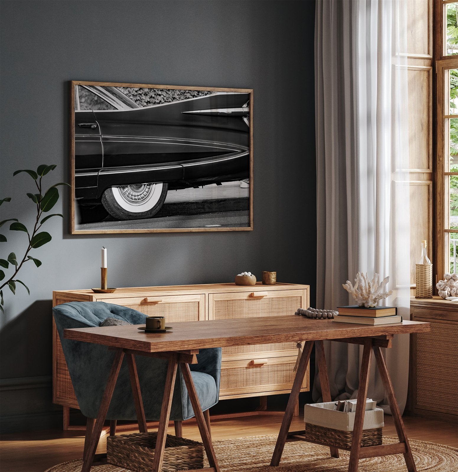 Framed photo of: Cadillac Fleetwood 7961 displayed above a desk in a moody office.