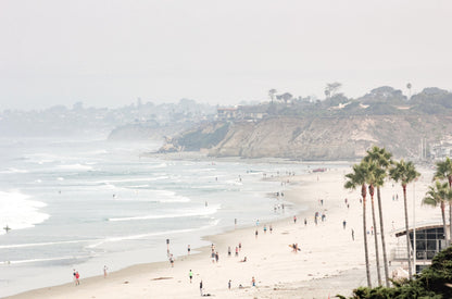 Photography by Kim Dybczak of: Del Mar Beach coastline appears in soft neutral tones along a wide, open shoreline.