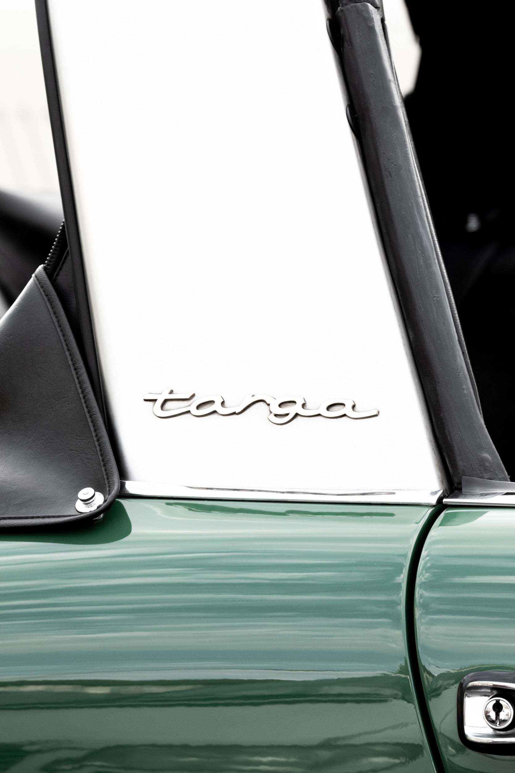 Photography by Salt Creek Prints of: Targa 8000, Close up image of the side of a classic vintage Targa Porsche in dark green and white.
