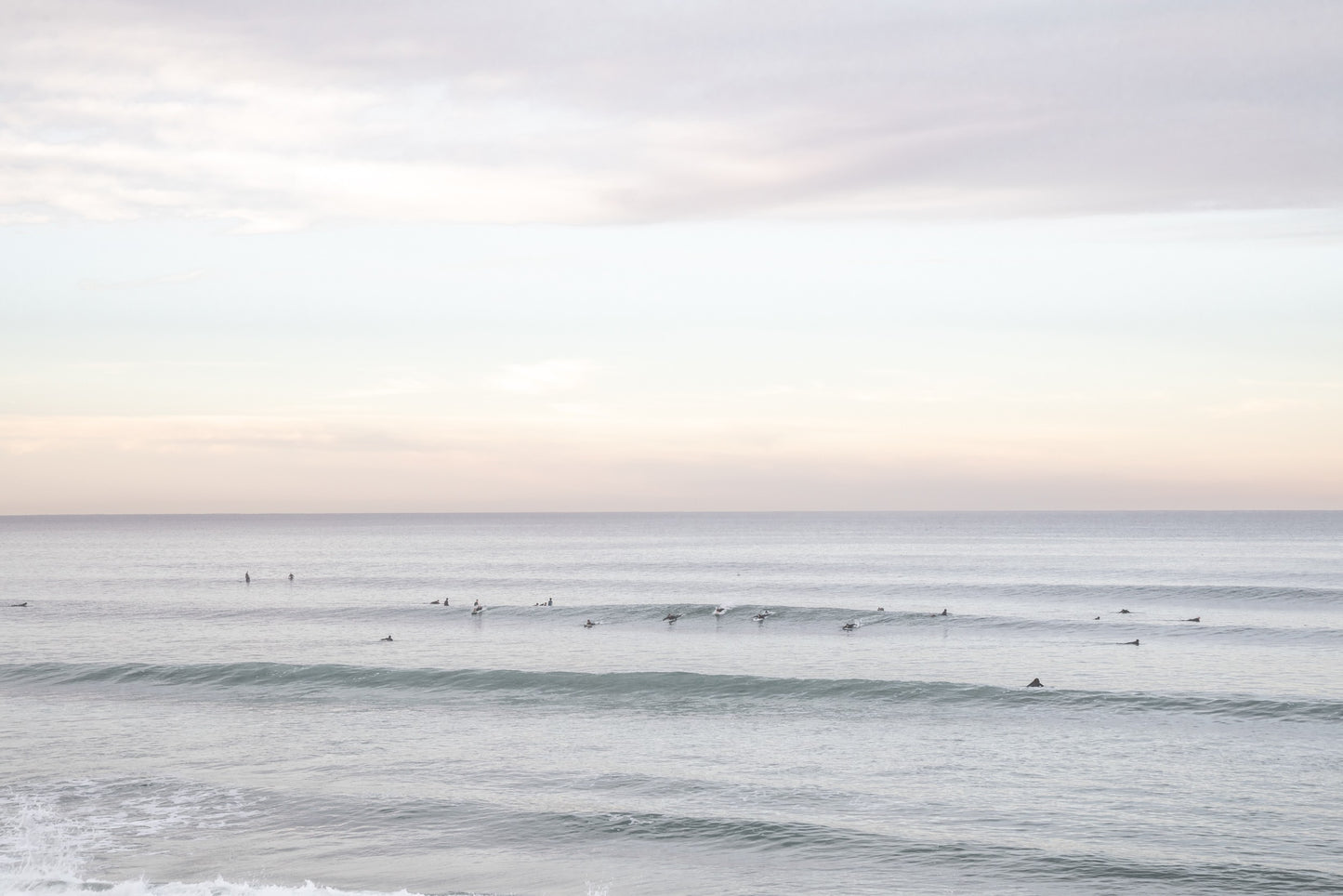 Surfers in the ocean at Del Mar, California, with a hazy peaceful feel, by Salt Creek Prints