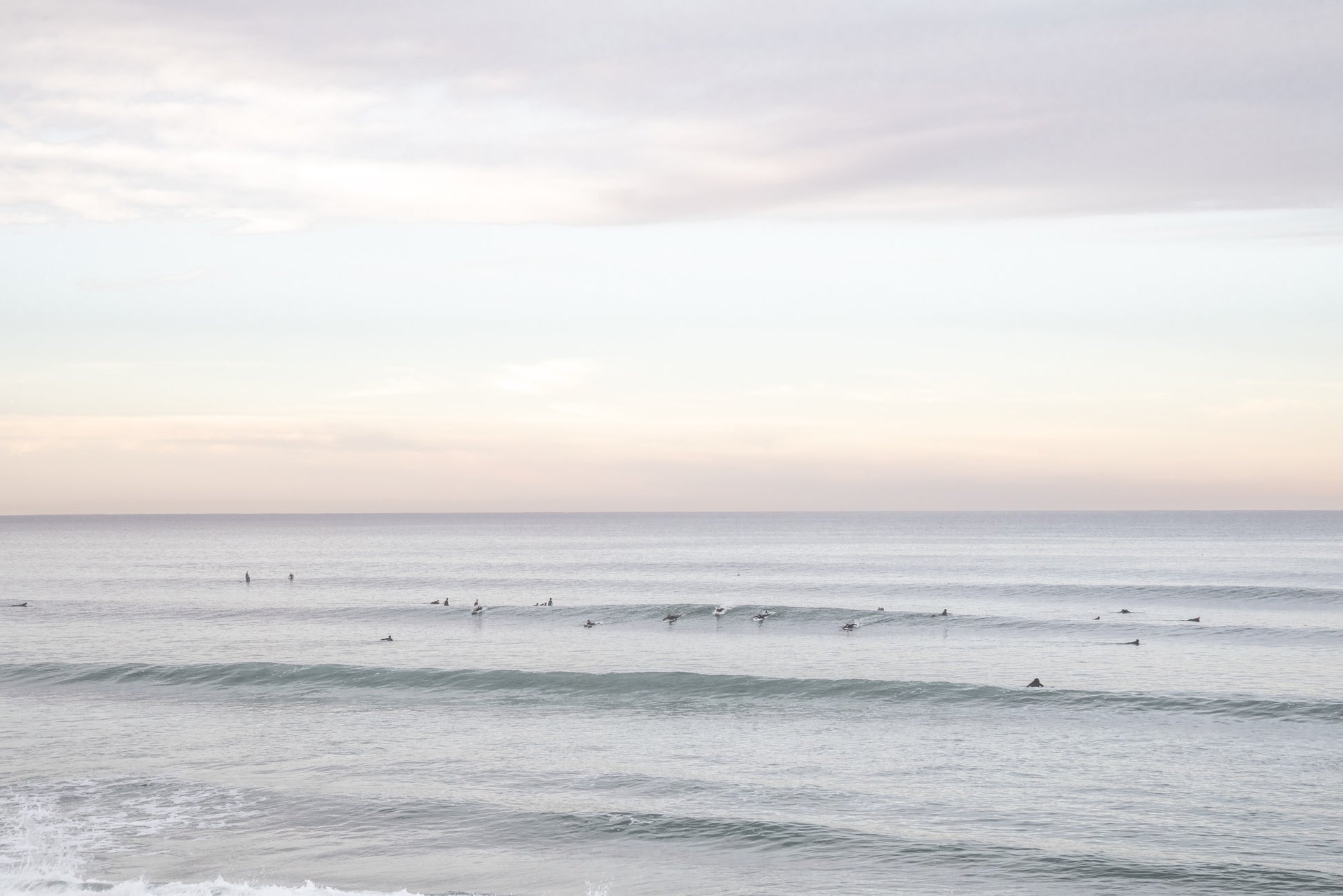 Surfers in the ocean at Del Mar, California, with a hazy peaceful feel, by Salt Creek Prints