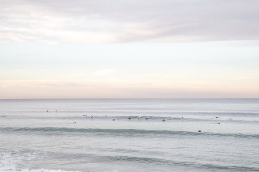Surfers in the ocean at Del Mar, California, with a hazy peaceful feel, by Salt Creek Prints