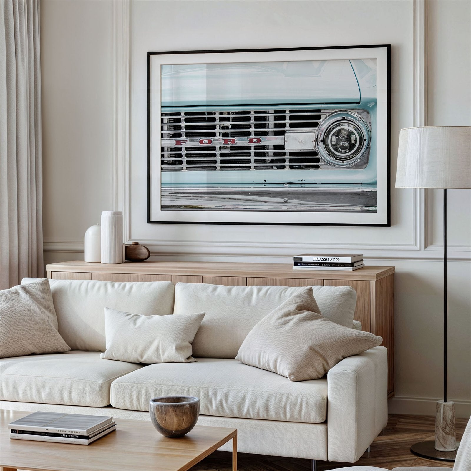 Framed photo of: Vintage Ford 7815 displayed above a couch in a living room.