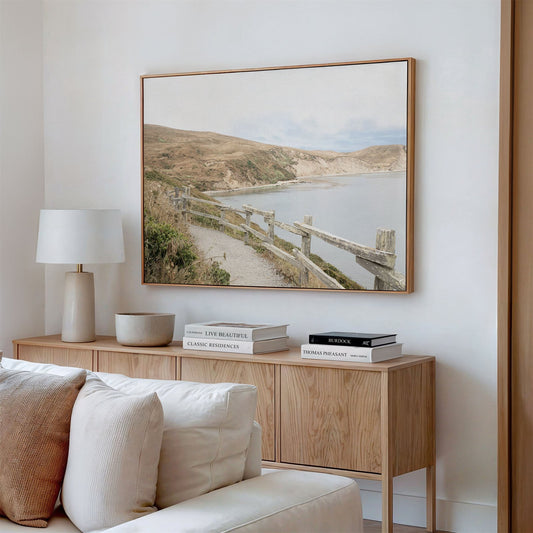 Framed canvas photo of: Drakes Bay 7372 displayed above a console in a modern living room.