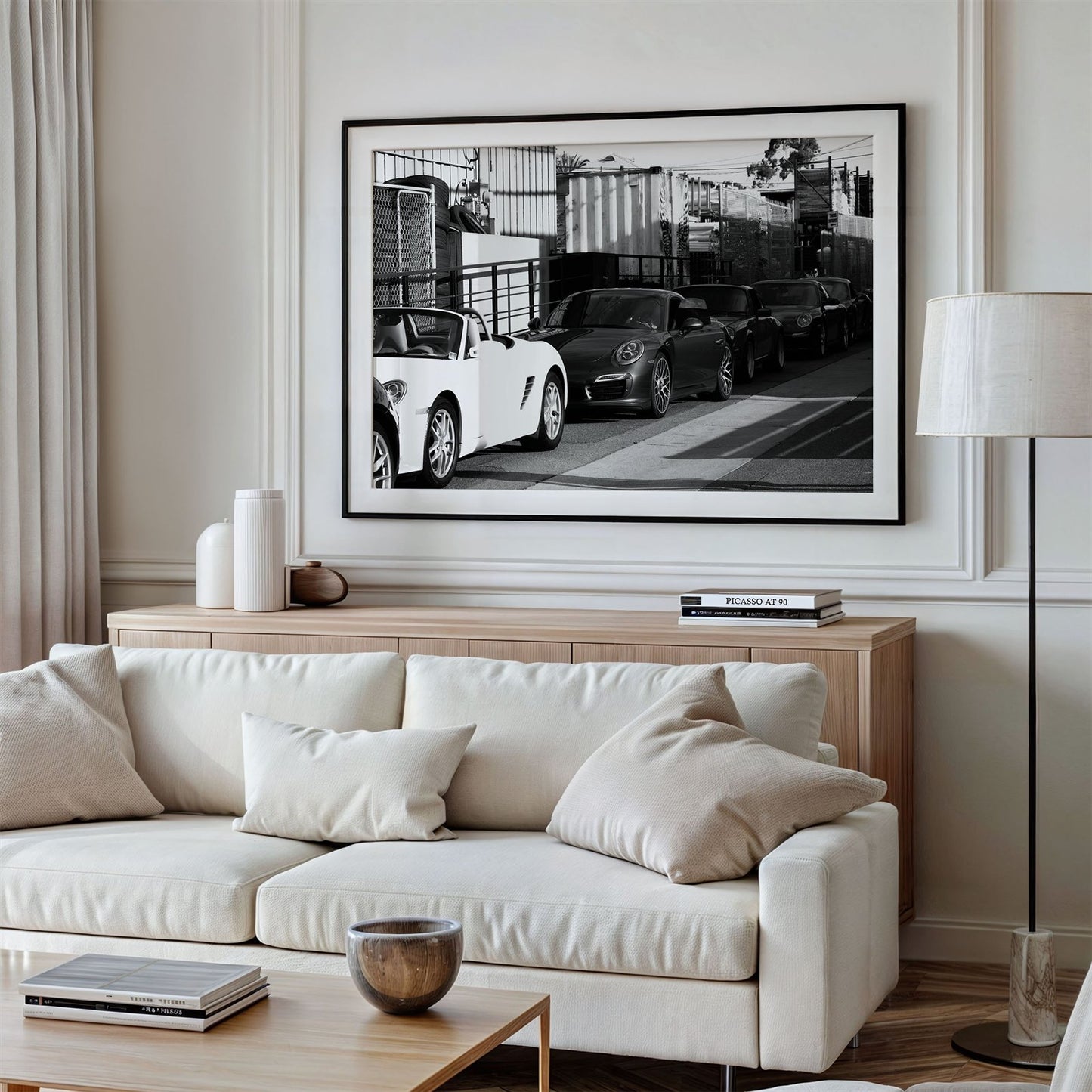 Framed photo of: Porsche 8352 displayed above a couch.