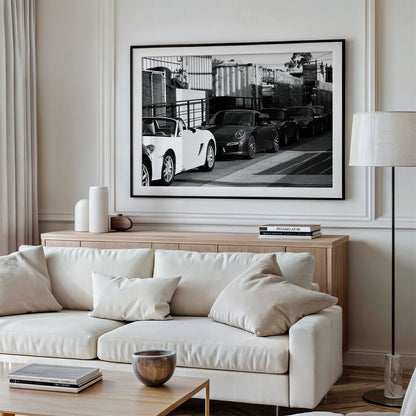 Framed photo of: Porsche 8352 displayed above a couch.