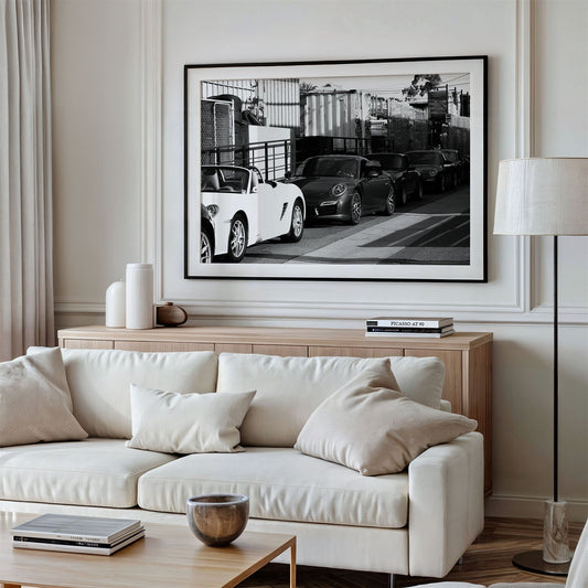 Framed photo of: Porsche 8352 displayed above a couch.
