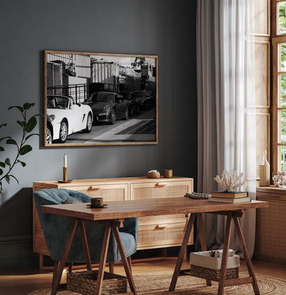 Framed photo of: Porsche 8352 displayed above a desk in a moody office.