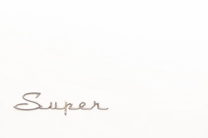 Photography by Salt Creek Prints of: Super 7772, Close up image of the Super logo from a classic Packard Clipper Super.